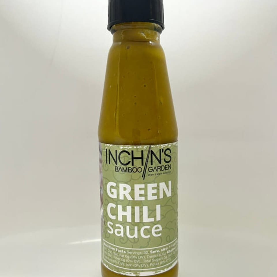 Inchin's Bamboo Garden green chili sauce bottle with a light green label and black cap.