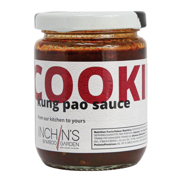 A jar of Inchin's Bamboo Garden Kung Pao Sauce with a white label and nutritional facts.