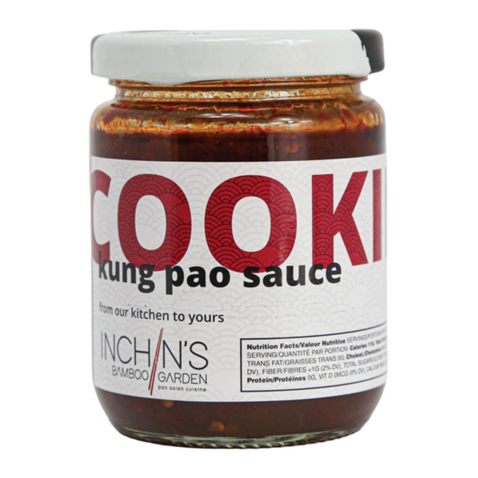 A jar of Inchin's Bamboo Garden Kung Pao Sauce with a white label and nutritional facts.