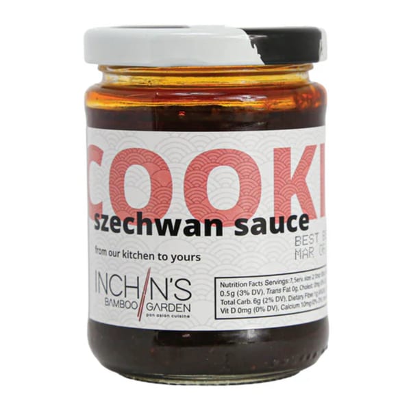 A jar of Inchin's Bamboo Garden Szechwan sauce with a white label and nutritional facts.