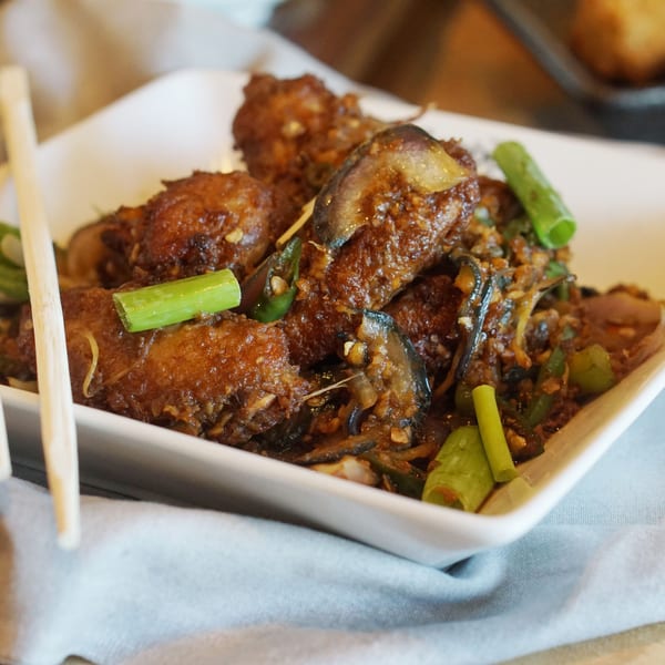 Inchin's Bamboo Garden's Asian-fusion dish with crispy chicken, mushrooms, and green onions.